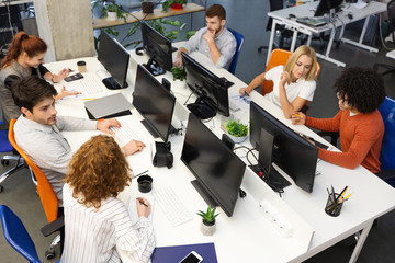 Wall Mural - Group of young business people working together