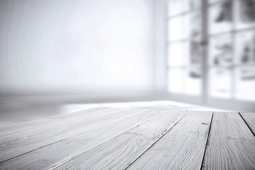 White wooden desk of free space and white window decoration 