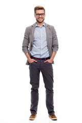full length portrait of young man standing on white background