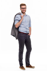 Wall Mural - full length portrait of young man standing on white background
