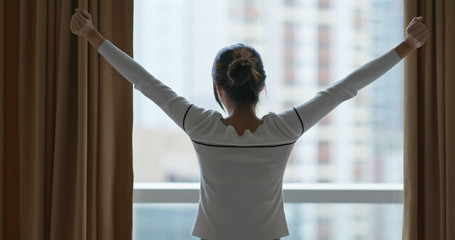 Wall Mural - Woman open the curtain