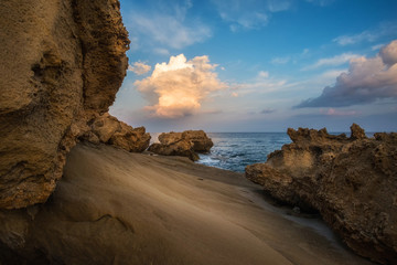 Morning landscape with rocky beach and beautiful sky