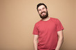 © lashkhidzetim - Young bearded man laughing, studio shot.