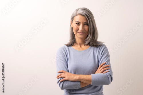 Mongolian Fine Gray Haired Woman on a White Background. Tableau sur Toile