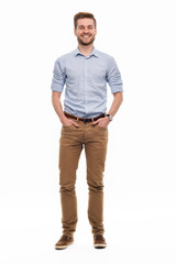 full length portrait of young man standing on white background