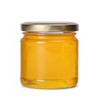 Glass jar full of sweet honey isolated on white background
