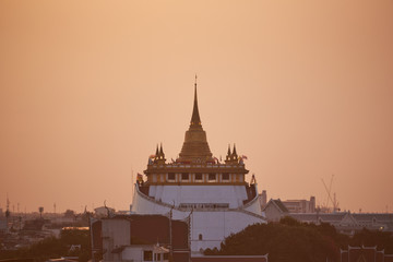 Scene of at golden mount temple before sunset