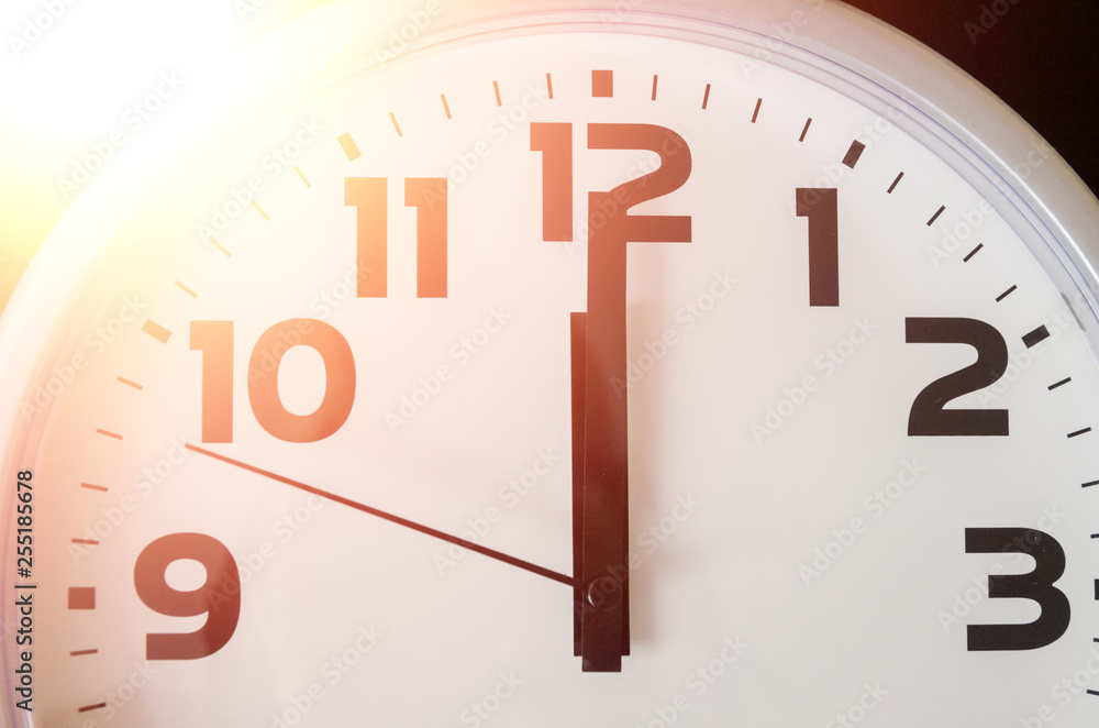 Macro photo of a black and white clock from 12 o'clock. Photo with a ...