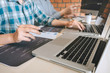 © Ngampol - Professional Developer programmer cooperation meeting and brainstorming and programming in website working a software outsourcing and coding technology, writing codes and database