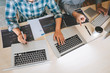 © Ngampol - Team of Professional Developer programmer cooperation meeting and brainstorming and programming in website working a software and coding technology, writing codes and database
