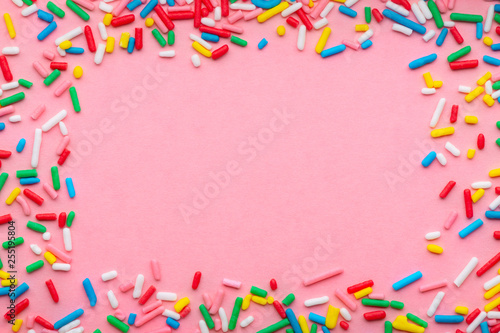 funny wreath of colorful sprinkles over pink background, festive invitation f...
