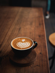 Wall Mural - coffee latte on the wood desk in cafe