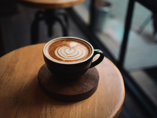 coffee latte on the wood desk in cafe