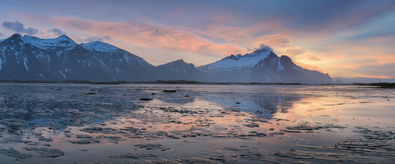 Wall Mural - Majestic Icelandic Bat Mountain vestrahorn sunrise water reflection. Most popular place in golden circle in Iceland. 