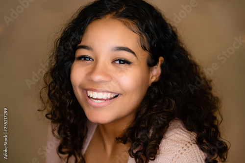 Beautiful Biracial High School Senior With Curly Hair Smiling