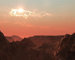 Wall Mural - Steep rough mountains at cloudy hazy sunset.