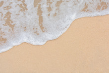 Soft Wave Of Sea On Empty Sandy Beach Background With Copy Space