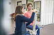 © Inti St. Clair - Physiotherapist talking with patient about spine injury