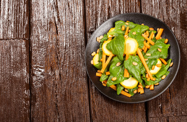 Sticker - Spinach and carrot salad - Wood background