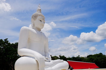 White Buddha With the blue sky, beautiful clouds in bright days.