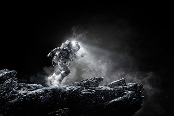 Wall Mural - Spaceman running fast. Mixed media