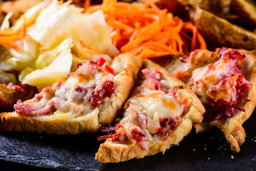 Poster - hot sandwiches on a dark background, set of snacks