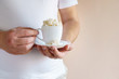 overweight man holding coffee cup with sugar cubes. sweet and calories content of drinks. unhealthy lifestyle, weight gain, diet, processed products