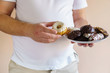 obesity prevention, healthy lifestyle, diet. fattening food, high-calorie snack. overweight man eating unhealthy sweet cookies