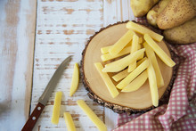 Sliced Potato Stick Ready For Making French Fries - Traditional Food Preparation Concept