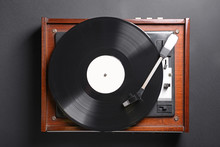 Record Player With Vinyl Disc On Dark Background
