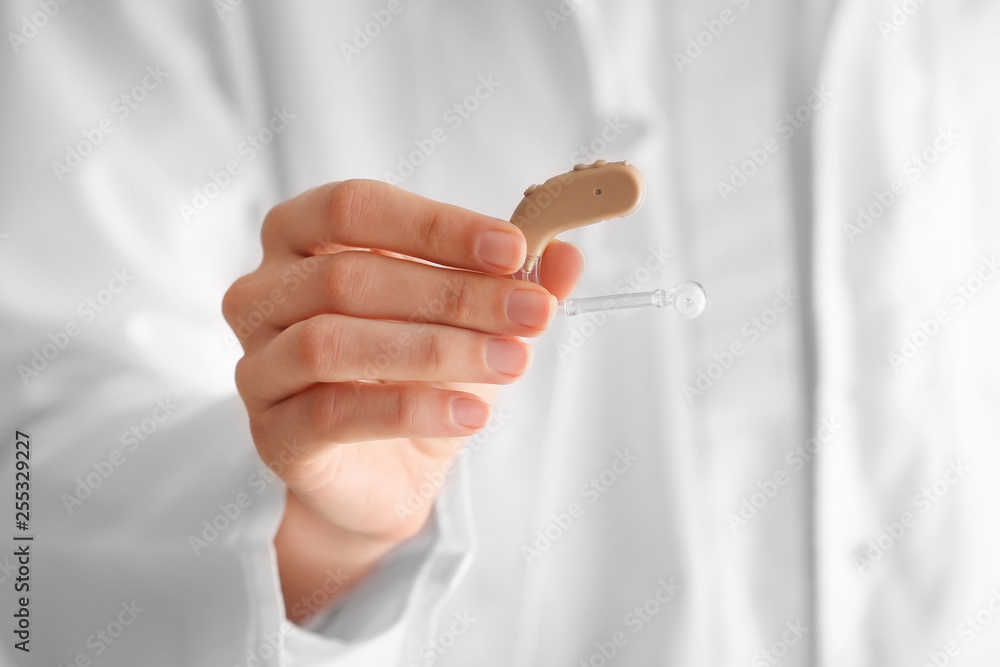 Female doctor with hearing aid, closeup
