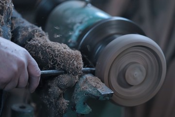 The Carpenter turning wood on a lathe.turkey