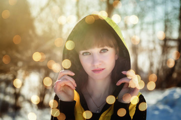 Wall Mural - Portrait of a gorgeous beautiful girl in nature in the spring on a Sunny day