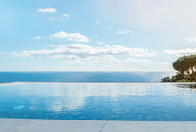 Luxury Swimming Pool In Front Of The Sea. Swimming Pool With Beautiful Sea And Sky View.
