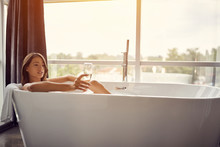 Relaxing In Bath- Beautiful Woman In Bath Drink Champagne .
