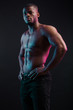 © alfa27 - Muscular man African bodybuilder. Man posing on a black background, shows his health and perfect shape.