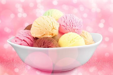 Wall Mural - Ice cream scoops in bowl on white background