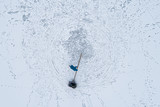 Fototapeta Kuchnia - Aerial view of family enjoying winter and sliding in nature