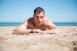 © Noelia - Attractive man posing on the beach