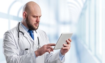 Poster - Close-up Doctor at hospital working with tablet pc