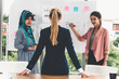 © InfiniteFlow - Multicultural working group. Team of businesswomen of different ethnicity, Caucasian, Asian and Arabic working together in team meeting at office. Multiethnic teamwork concept.