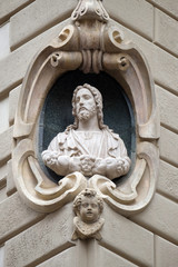 Wall Mural - Jesus Christ, statue on the house facade  in Florence, Italy