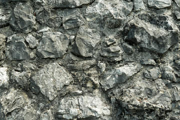 Part of the wall of stone cobblestones.