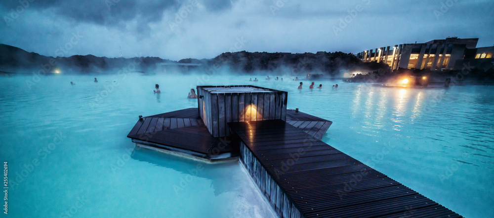 Reykjavik, Iceland - July 4, 2018: Beautiful geothermal spa pool in Blue Lagoon in Reykjavik. The Blue Lagoon geothermal spa is one of the most visited attractions in Iceland. - obrazy, fototapety, plakaty 