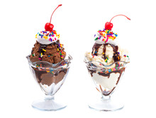 Vanilla And Chocolate Sundaes Isolated On A White Background With Cherries On Top