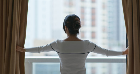 Wall Mural - Woman open the curtain