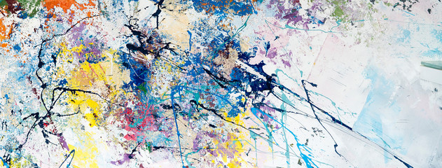 Multicolored abstraction of splashes of acrylic paints. On a white background