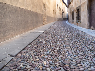 cobblestone pavement at medieval street in Bergamo