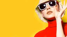 Beautiful Young Woman With Sunglasses And Hat, Retro Style On Yellow. Summer Holiday