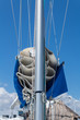 Catamaran Sail. folded sail ready to go against a blue sky